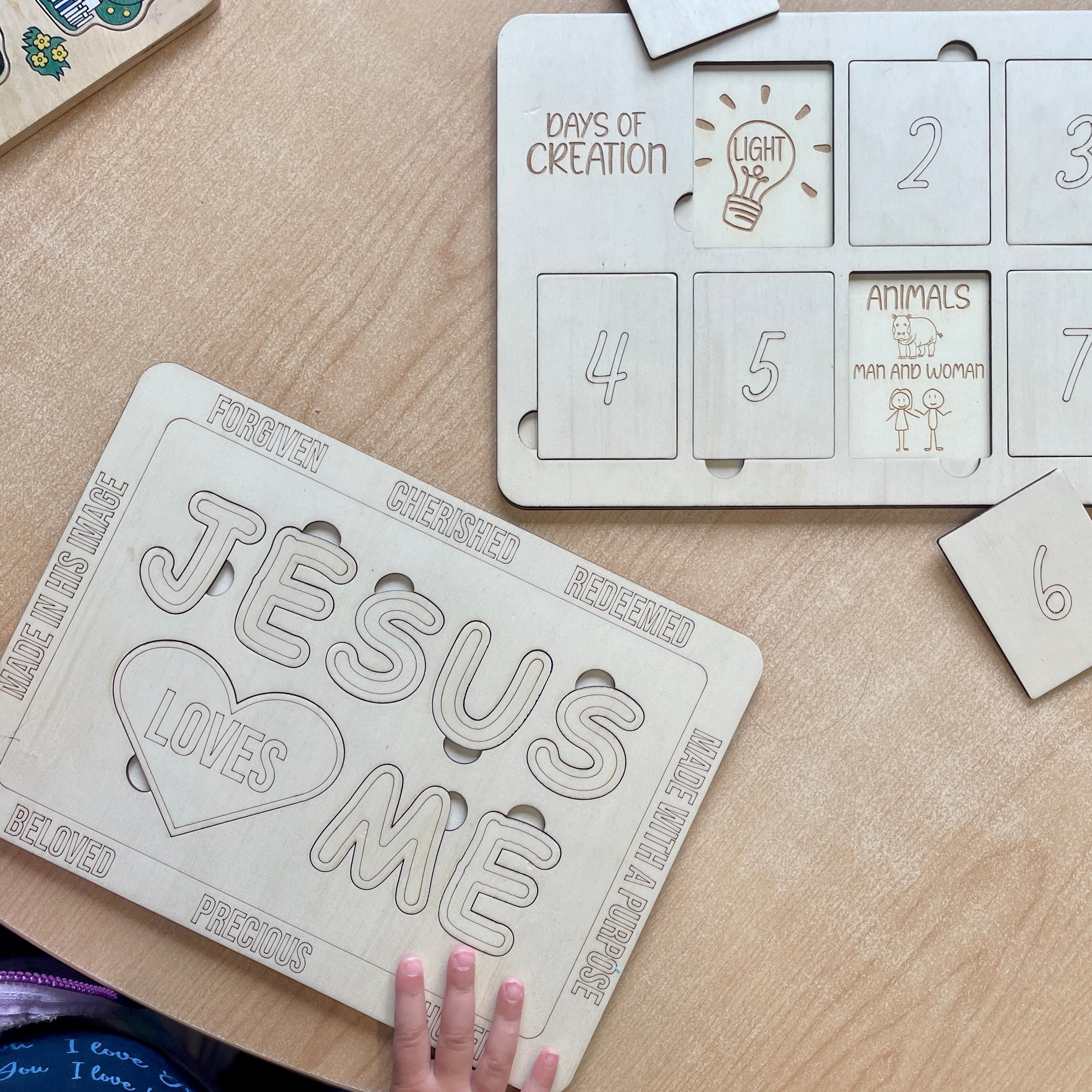 Children's educational puzzle with 'Jesus Loves Me' and 'Days of Creation' designs for learning at home and school